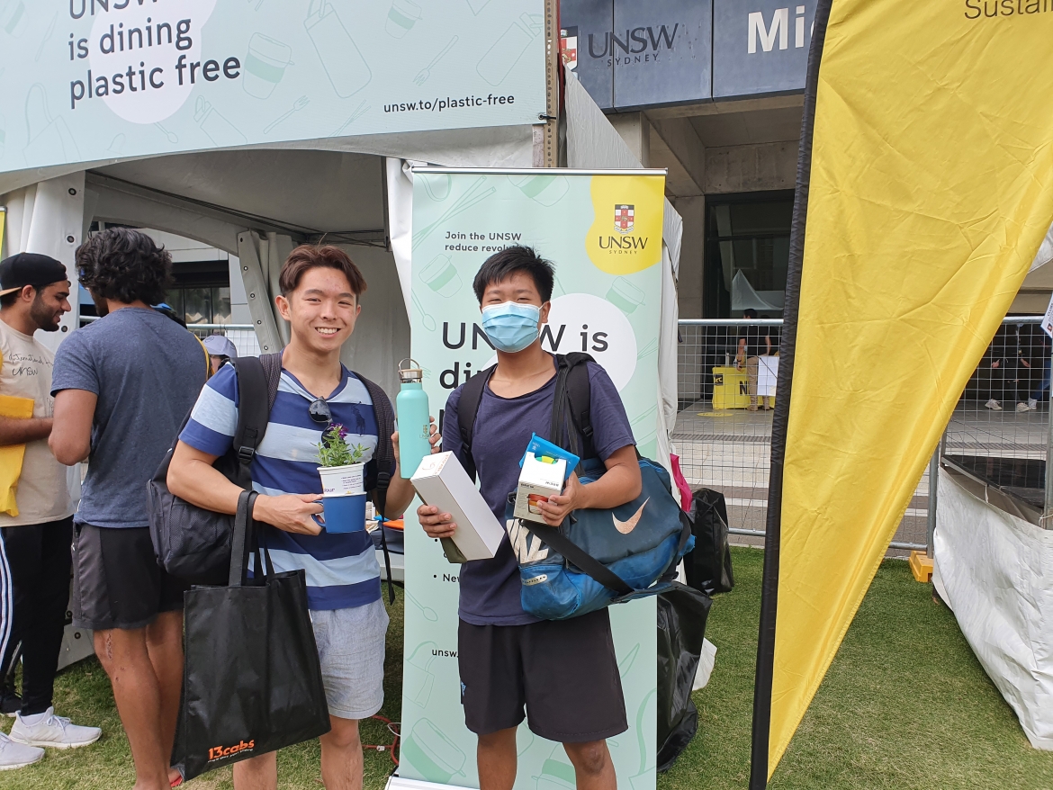 Two students standing in front of Plastic Free UNSW O-Week Stall