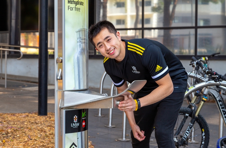 UNSW student drinking from water bubbler